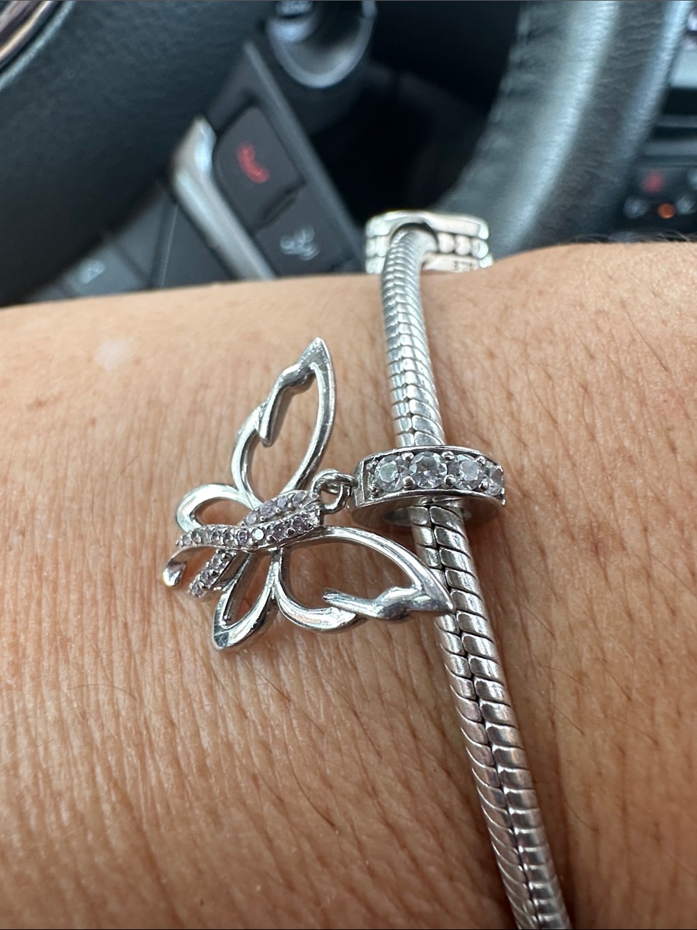 Sterling Silver Butterfly Charm in sterling Silver with pinkish ribbon Stones